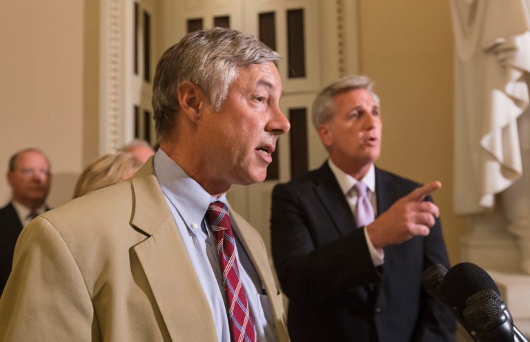 Rep. Fred Upton, R-Mich., left, chairman of the Committee on Energy and Commerce, and House Majority Whip Kevin McCarthy, R-Calif., right, speak to reporters just before a vote to delay the individual and employer mandates of President Barack Obama's signature health care law, at the Capitol in Washington, Wednesday, July 17. (AP/J. Scott Applewhite)