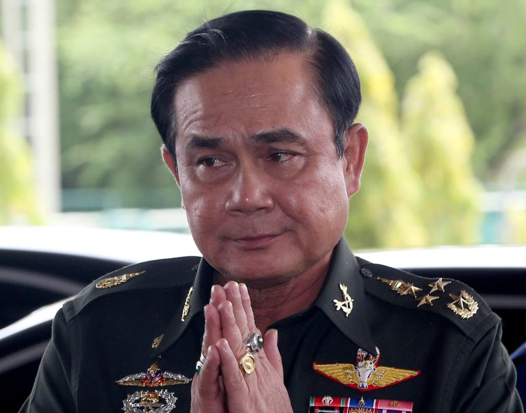 FILE - In this Tuesday, May 20, 2014 file photo, Thai Army Chief Gen. Prayuth Chan-Ocha greets back his junior upon his arrival at army club for a meeting with high ranking officials after declaring martial law in Bangkok, Thailand.  Thailand's coup leader said the country's monarchy has officially endorsed him to run the country after the armed forces seized power last week. Gen. Prayuth Chan-ocha said he received the endorsement Monday, May 26,  formalizing his status as head of government at the army headquarters in Bangkok (AP Photo/Apichart Weerawong, File)