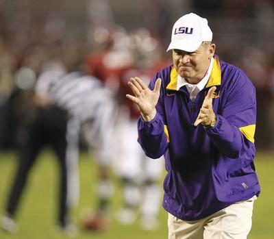 LSU head coach Les Miles cheers before the first half of an NCAA college football game against Alabama, Saturday, Nov. 5, 2011, in Tuscaloosa, Ala.(AP Photo/Butch Dill)