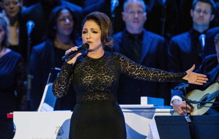 Cuban-born singer Gloria Estefan posted a photo to Instagram Saturday of a boat full of Cuban refugees with a message denouncing Castro. (Andrew Burton/Pool Photo via AP)