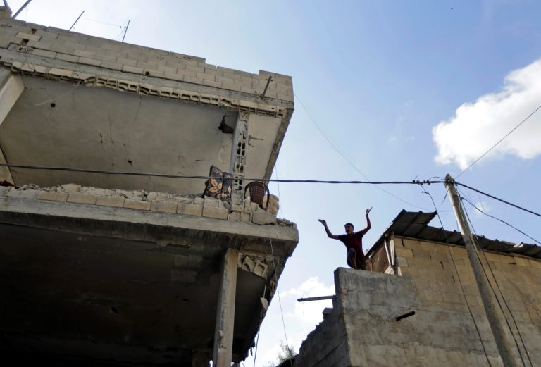 A member of the Keferna family cries upon his return to the family house, which was destroyed by Israeli strikes in Beit Hanoun, northern Gaza Strip, Saturday, July 26, 2014. (AP Photo/Lefteris Pitarakis)