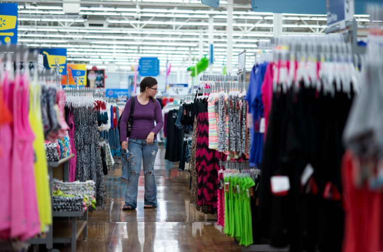 In this June 5, 2014 photo, Chelsea Vick shops for clothes at Wal-Mart Supercenter in Rogers, Ark. The Commerce Department releases retail sales data for September 2014 on Wednesday, Oct. 15, 2014. (AP Photo/Sarah Bentham)