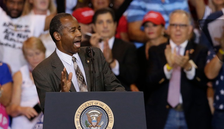 Carson gave an introduction before Trump started his controversial speech in Phoenix. (AP Photo/Rick Scuteri)
