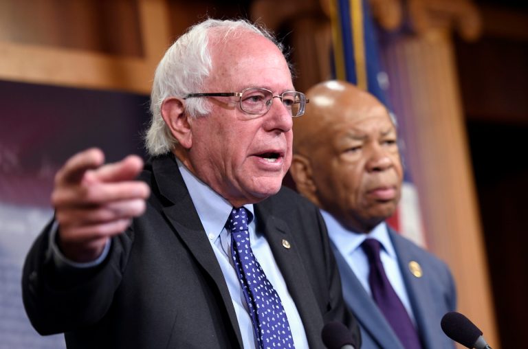 Democratic presidential candidate Sen. Bernie Sanders, I-Vt., left, accompanied by Rep. Elijah Cummings, D-Md., said thatÂ Turing Pharmaceuticals' Martin Shkreli hasn't lowered the price of a drug that he jacked up 5,000 percent. (AP Photo/Susan Walsh)