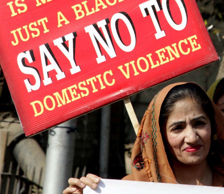 A woman who immigrated from India, eight months pregnant, records on audio one of the typical beatings she gets from her husband. (AP Photo/K.M. Chaudary)