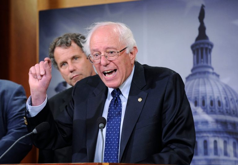 Sen. Bernie Sanders, right, joined by Sen. Sherrod Brown, speaks during a news conference on Capitol Hill in Washington. (AP Photo)