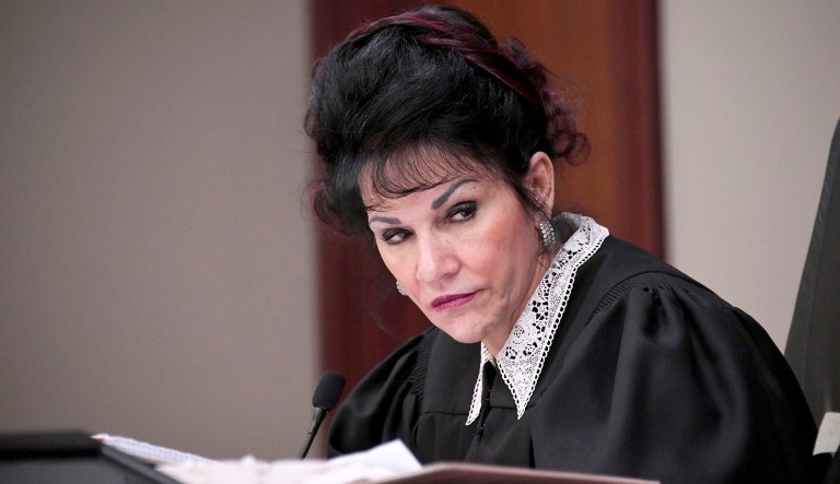 Judge Rosemarie Aquilina listens to Abigayle Bergeron's victim statement during the sixth day of Larry Nassar's sentencing hearing Tuesday, Jan. 23, 2018, in Lansing, Mich. Nassar has admitted sexually assaulting athletes when he was employed by Michigan State University and USA Gymnastics, which is the sport's national governing organization and trains Olympians. (Dale G. Young/Detroit News via AP)