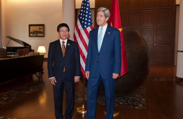 U.S. Secretary of State John Kerry, right, meets with Vietnam's Foreign Minister Pham Binh Minh, left,  at a hotel during their meeting outside the venue of the 47th ASEAN Foreign Ministers' Meeting in Naypyidaw Saturday, Aug. 9, 2014.  U.S. Secretary of State Kerry is in Myanmar seeking to calm tensions in the South China Sea between China and its smaller neighbors.  (AP Photo/Nicolas Asfouri, Pool)