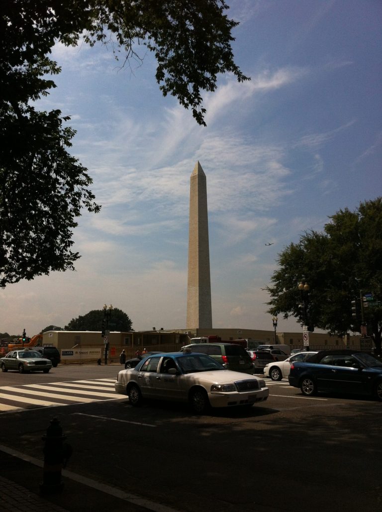 The Washington Monument on Wednesday. A year after an earthquake hit the D.C. region, the monument is still undergoing repairs. (Rachel Baye/Examiner photo)