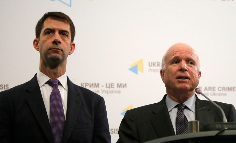 Sen. John McCain tweeted an image of him and Sen. Tom Cotton flying over the South China Sea on Friday. (AP Photo/Sergei Chuzavkov)