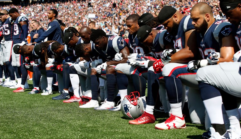 Several New England Patriots players kneel during the national anthem before an NFL football game against the Houston Texans, Sunday, Sept. 24, 2017, in Foxborough, Mass. (AP Photo/Michael Dwyer)