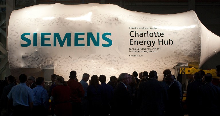 Siemens unveils its first manufactured gas turbine in Charlotte, NC. Obama subsidized a Siemens plant in North Carolina in the run-up to the 2012 convention. (Jason E. Miczek/AP Images for Siemens).