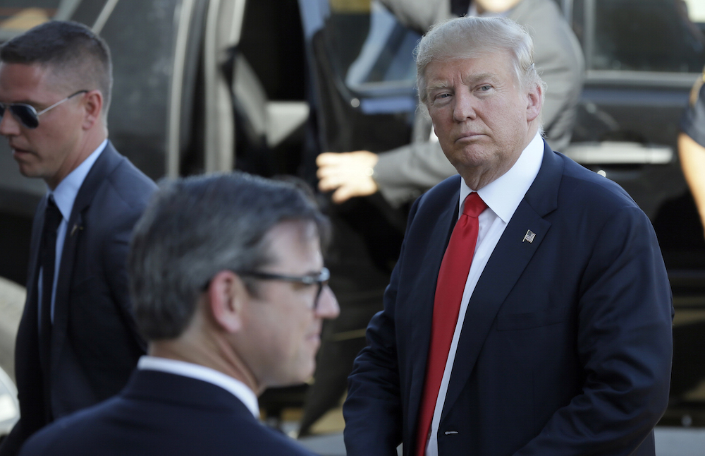 Trump defends management style, small staff