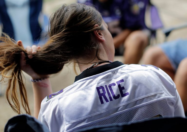 Samantha Dell wears a Baltimore Ravens' Ray Rice jersey as she tailgates before an NFL football game against the Pittsburgh Steelers on Thursday in Baltimore, Md. (AP/Patrick Semansky)