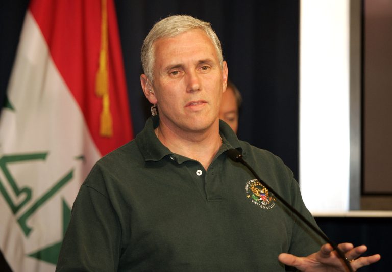 Indiana Gov. Mike Pence has held contrary positions to what Trump has espoused on trade, immigration and Muslim rights. (AP Photo/Sabah Arar, Pool)