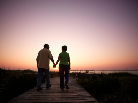 Middle-Aged Couple Walking on a Boardwalk