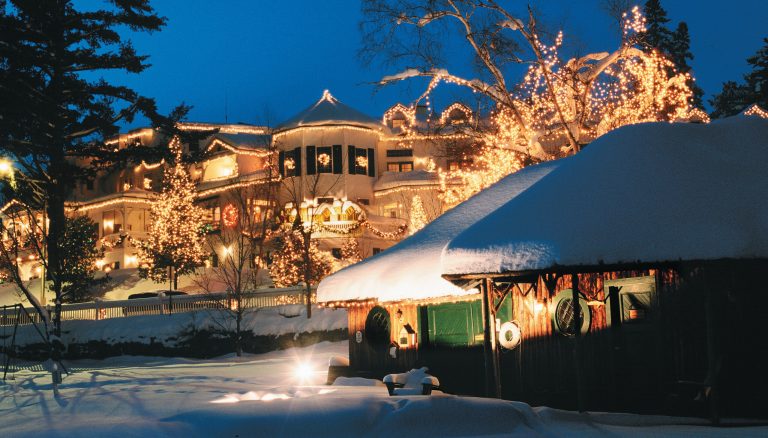   This 2011 photo provided by the Mirror Lake Inn, shows the inn decked out with holiday lights in Lake Placid, N.Y. The inn was founded in the 1920s as Mir-a-Lac, was renamed Mirror Lake Inn in 1933 and has been owned by Ed and Lisa Weibrecht since 1976. (AP Photo/Mirror Lake Inn/Shaun Ondak)  