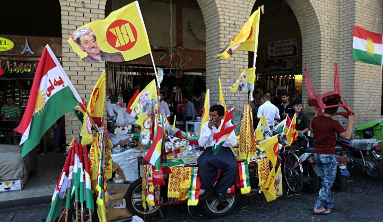 A street vendor sells Kurdish flags and pro-independence items in central Irbil, 217 milesnorth of Baghdad, Iraq, Sunday, Sept. 24, 2017. Iraq's Kurdish region will vote on Monday's referendum for Kurdish independence, a vote dismissed as illegal and destabilizing by the central government and the international community. (AP Photo/Khalid Mohammed)