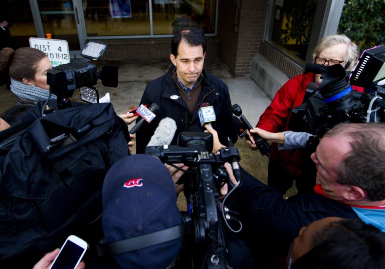 Wisconsin Gov. Scott Walker talks to the media after he casts his ballot on election day at Jefferson Elementary School, Nov. 4, 2014 in Milwaukee, Wisconsin. (Photo by Darren Hauck/Getty images)