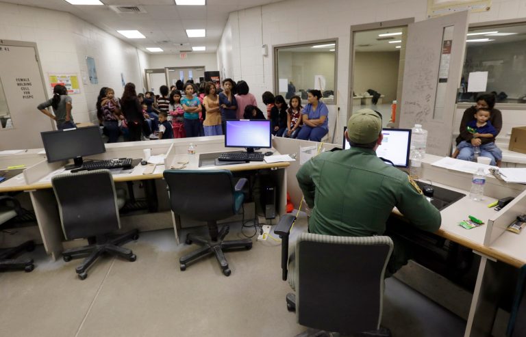 U.S. Customs and Border Protection agents work at a processing facility in Brownsville,Texas. (AP/Eric Gay, Pool)
