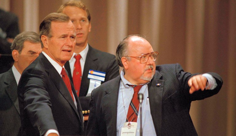 In this Aug. 17, 1988 file photo, Vice President George H.W. Bush, left, gets some advice from his media advisor, Roger Ailes, right, as they stand behind the podium at the Superdome in New Orleans, La., prior to the start of the Republican National Convention. Fox News said on Thursday, May 18, 2017, that Ailes has died. He was 77. (AP Photo/Ron Edmonds)