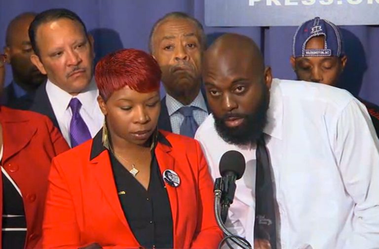 In this image from video the parents of Michael Brown, Lesley McSpadden and Michael Brown, Sr., speak at a news conference with civil rights leaders at the National Press Club Thursday, Sept. 25, 2014  in Washington. Brown's parents were joined by Eric Garner's mother in calling for full federal investigations into the death of their sons, two unarmed black men who died in police encounters. (AP Photo/AP Video)