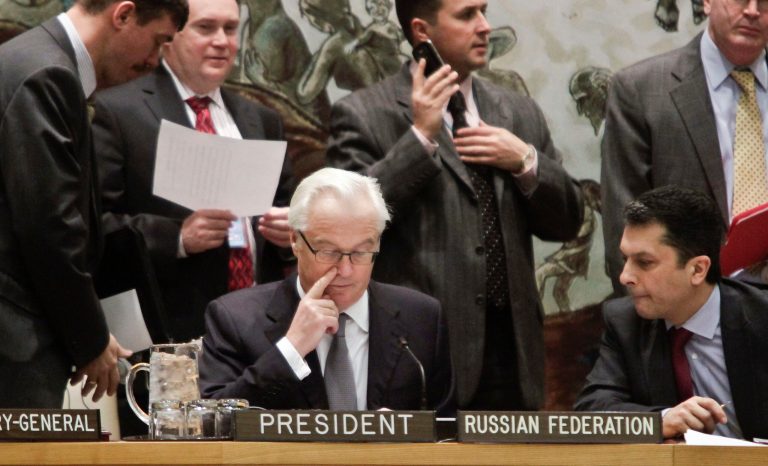 Russia's UN Ambassador Vitaly Churkin, center, current president for the U.N. Security Council, confers before leading council members on a vote for tough new sanctions against North Korea for its latest nuclear test, during a meeting at U.N. headquarters Thursday, March 7, 2013. The unanimous vote by the U.N.'s most powerful body sparked a furious Pyongyang to threaten a nuclear strike against the United States. (AP Photo/Bebeto Matthews)