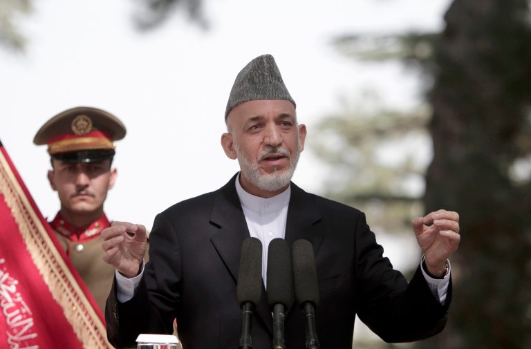 Afghan President Hamid Karzai speaks during a press conference at the presidential palace in Kabul, Afghanistan, Monday, Oct. 7, 2013. Karzai says disagreements over security and sovereignty are impeding a security deal with the United States and says he will convene a council of elders in one month to discuss the agreement. (AP Photo/Rahmat Gul)
