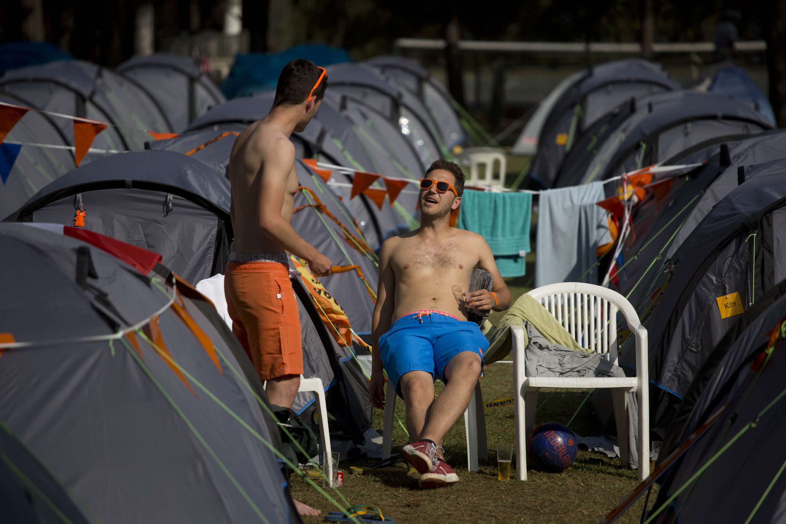 In Brazil camp for Dutch fans, color helps unite