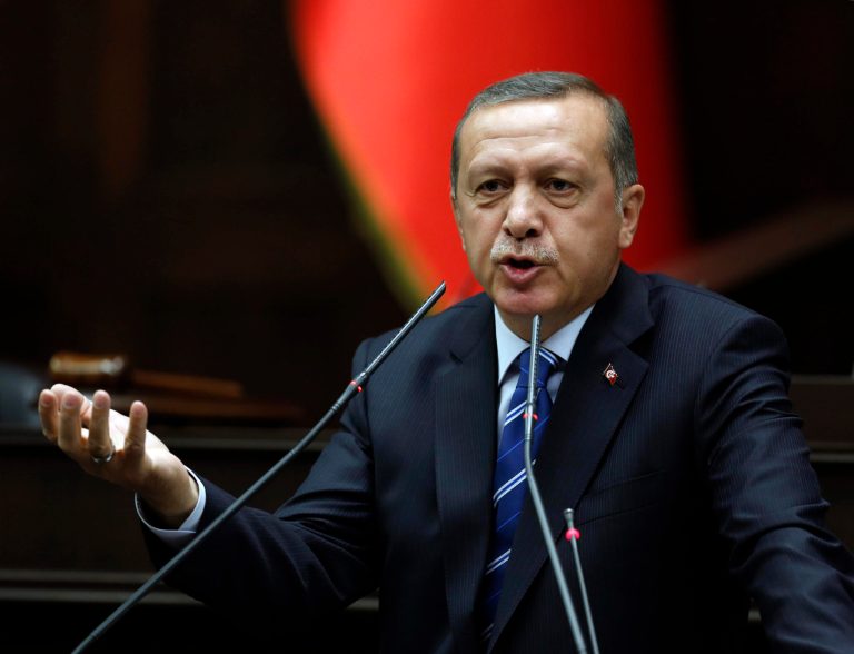 Turkish Prime Minister Recep Tayyip Erdogan addresses his supporters at the parliament in Ankara, Turkey, Tuesday, April 29, 2014. Erdogan said Turkey will ask the United States to extradite Turkish Islamic spiritual leader Fethullah Gulen. Erdogan has accused Gulen of orchestrating an alleged plot aimed to undermine and bring down his government. (AP Photo)