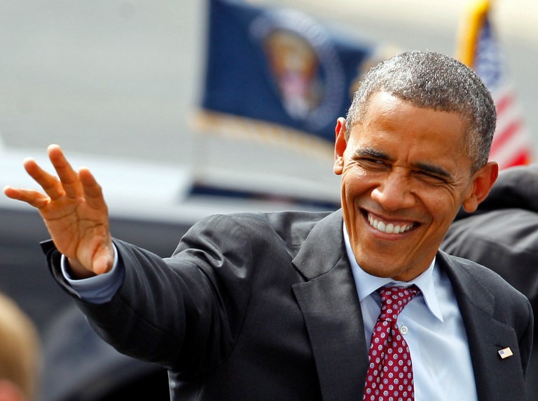 President Barack Obama waves to supporters as he arrives at the Charlotte/Douglas International Airport for the Democratic National Convention in Charlotte, N.C., Wednesday, Sept. 5, 2012. (AP Photo/Chuck Burton)