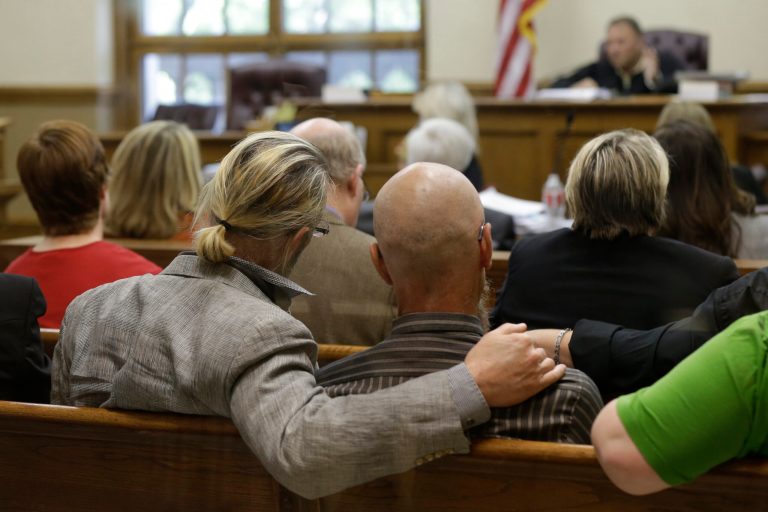 Spectators watch proceedings in Circuit Judge Chris Piazza's courtroom at the Pulaski County Court House in Little Rock, Ark. (AP Photo/Danny Johnston)
