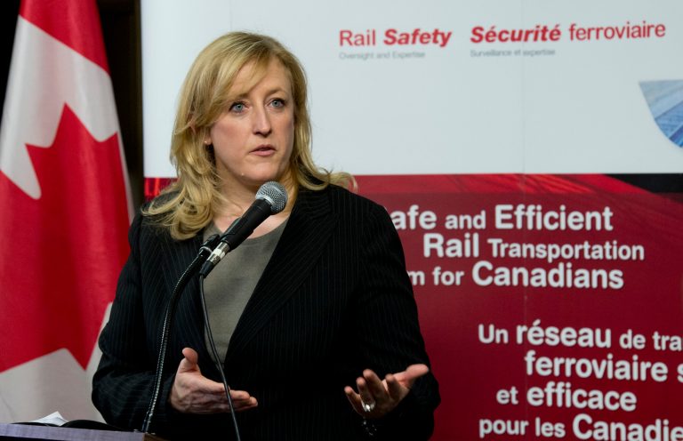 Transport Minister Lisa Raitt announces new railway safety measures during a news conference on Wednesday, April 23, 2014 in Ottawa, Ontario.  Raitt announced that the DOT-111 tankers, which are used to carry crude oil and ethanol and are prone to rupture, must be retired or retrofitted within three years. (AP Photo/The Canadian Press, Adrian Wyld)