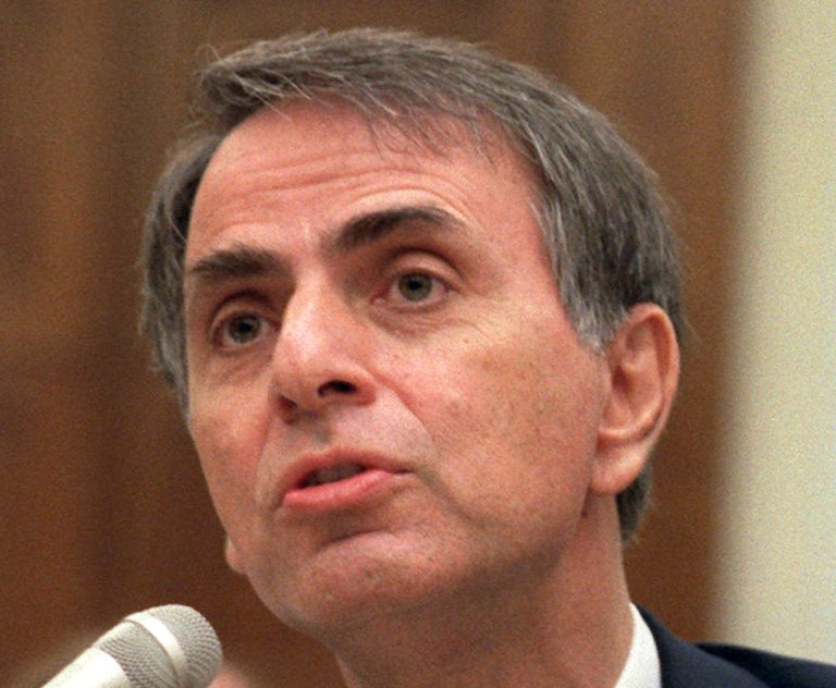 FILE - In this Aug. 1996 file photo, astronomer Carl Sagan speaks in Washington. Astronomers and scientists are joining Seth MacFarlane at the Library of Congress for the opening of a new collection of Carl Sagan's papers. The library has acquired the late astronomer's papers with a donation from MacFarlane, the creator of TV's 