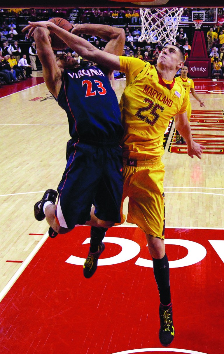 Patrick Semansky/AP
Virginia freshman Justin Anderson finished with 17 points and nine rebounds and helped hold Maryland's leading scorer, Alex Len, to just nine points in a victory Sunday.