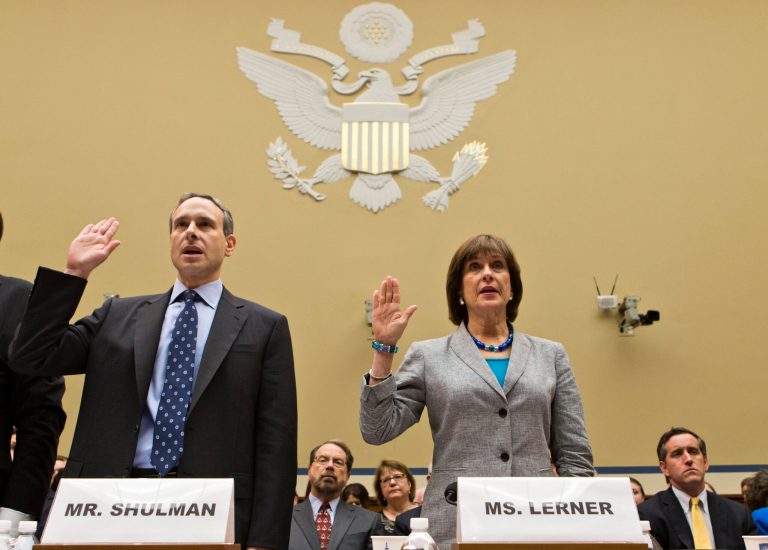 Former IRS Commissioner Douglas Shulman, left, and Lois Lerner, right, head of the IRS unit that decides whether to grant tax-exempt status to groups, are sworn in on Capitol Hill in Washington, prior to testifying before the House Oversight and Government Reform Committee hearing. (AP Photo/J. Scott Applewhite)