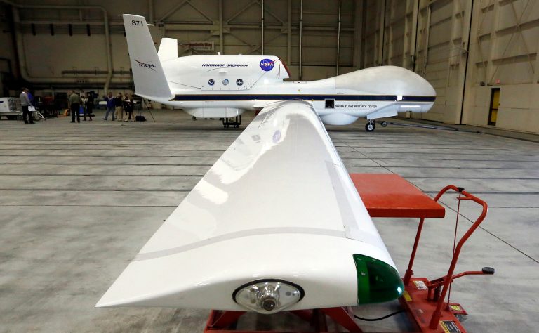 NASA's Global Hawk pilotless aircraft sits in a hangar after arriving from a science mission monitoring tropical storm Gabrielle, during a survey of unmanned aircraft and related systems developed by the NASA Dryden Flight Research Center at Edwards Air Force Base, Calif. (AP/Reed Saxon)