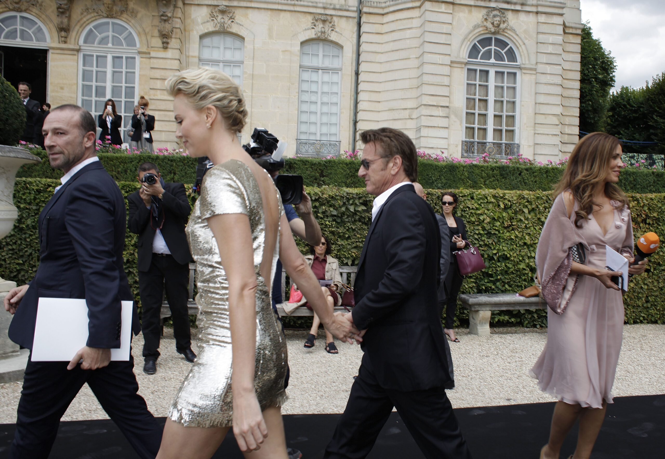 Theron, Penn dazzle Dior as fashion gets political