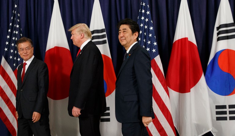 Together, the trio decided, they would push for stronger sanctions against Pyongyang, the White House said. (AP Photo/Evan Vucci)