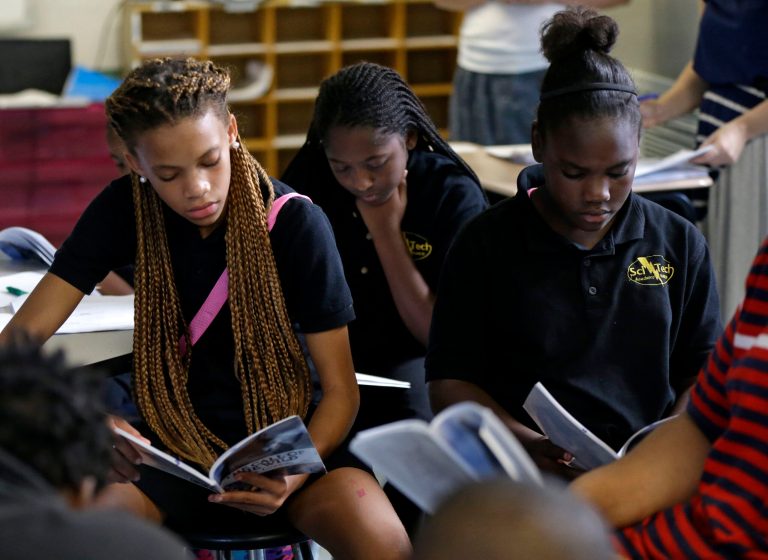ixth grade students Miracle Roberson, left, Darion James, and Brianetay Martin, right, read during literature intervention class at ReNEW SciTech Academy, a charter school in New Orleans, Thursday, Aug. 14, 2014. After Hurricane Katrina, charter schools are the new reality of public education in New Orleans. The vast majority of public school students will be attending a charter school established by a state-run school district created in the wake of the storm. (AP Photo/Gerald Herbert)