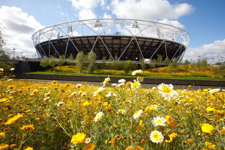   FILE This is a image released on Sept. 30, 20011 by the London 2012 Olympic Delivery Authority shows the parklands area in the south of the Olympic Park looking towards the Olympic Stadium in London. Premier League soccer team West Ham has been named 