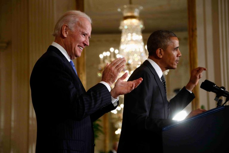 Vice President Joe Biden applauds as President Barack Obama speaks about immigration reform, Thursday, Oct. 24, 2013, in the East Room of the White House in Washington. The president said now that the partial government shutdown is over, Republicans and Democrats should be able to work together to fix what he called 