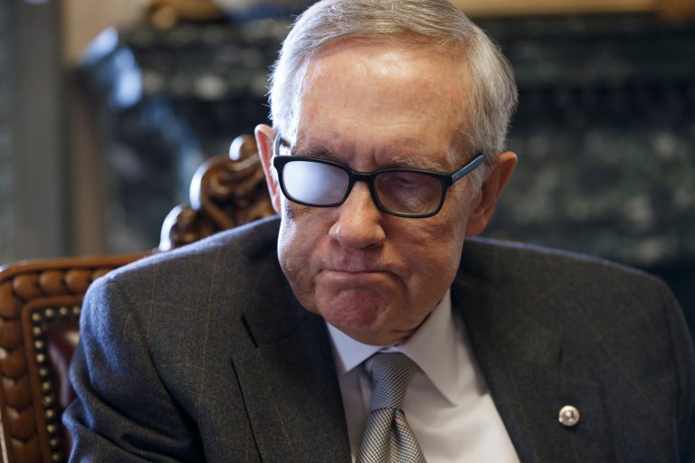 Senate Minority Leader Harry Reid of Nevada gives an interview with in his office on Capitol Hill in Washington. Reid, 75, is wearing special glasses as part of his recovery from injuries suffered in a violent exercise accident in January. (AP Photo/J. Scott Applewhite)