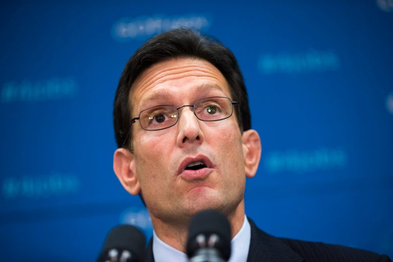 About two dozen pro-immigration activists chanted in front of a condo complex where House Majority Leader Eric Cantor, R-Va., maintains a residence one night last week. (AP/J. Scott Applewhite)