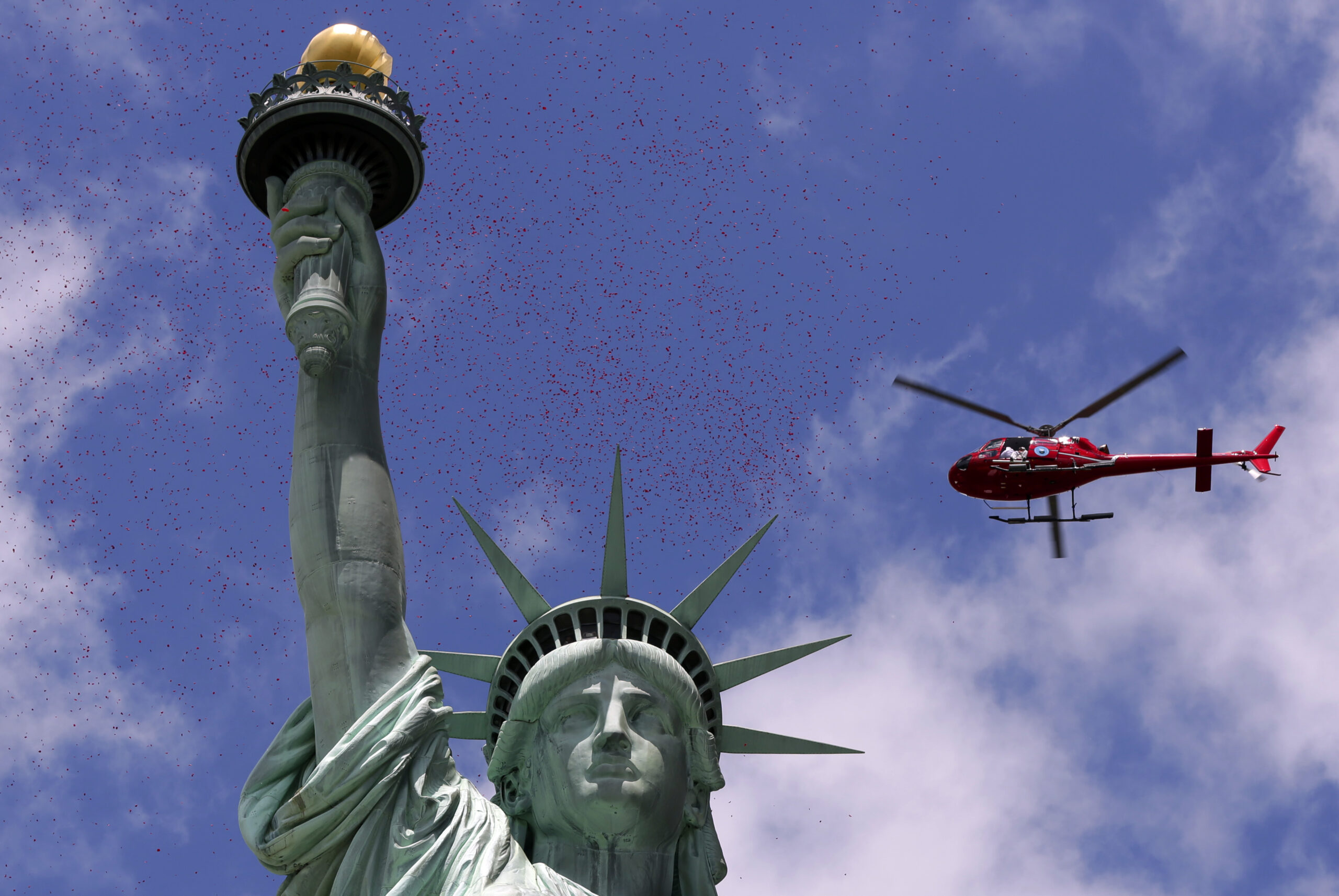 Lady Liberty showered with rose petals for D-Day