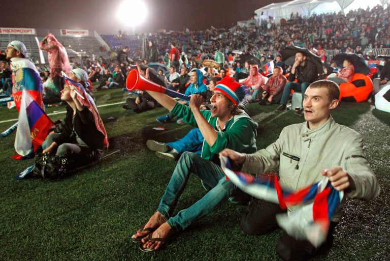   Russian soccer fans react as watch of the Euro 2012 soccer championship Group A match between Russia and Czech Republic on the screen at the Luzhniki stadium in Moscow, Russia, Friday, June 8, 2012. (AP Photo/Mikhail Metzel)  