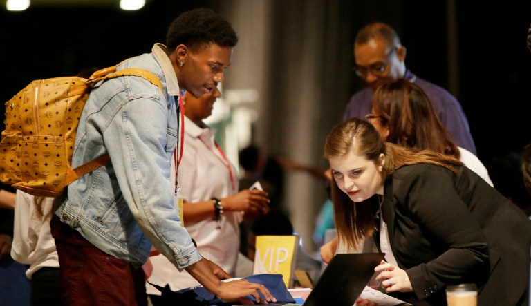 About 228,000 workers were added to November payrolls, according to the Bureau for Labor Statistics. But what is really going on in the American economy? (AP Photo/LM Otero)