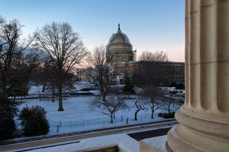 The Capitol in Washington, Thursday morning, Jan. 21, 2016, after less than an inch of overnight snow created hazardous road conditions and major traffic delays. The Washington region could get up to two feet of snow along with strong winds and whiteout conditions on Friday night and Saturday. (AP Photo/J. Scott Applewhite)