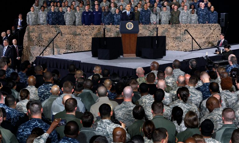 President Obama addresses a gathering of military members and families Dec.15, 2014, at Joint Base McGuire-Dix-Lakehurst, in Wrightstown, N.J. Obama's approval rating among active-duty service members has plummeted to 15 percent this year, according to a new poll.Â (AP Photo/Mel Evans)