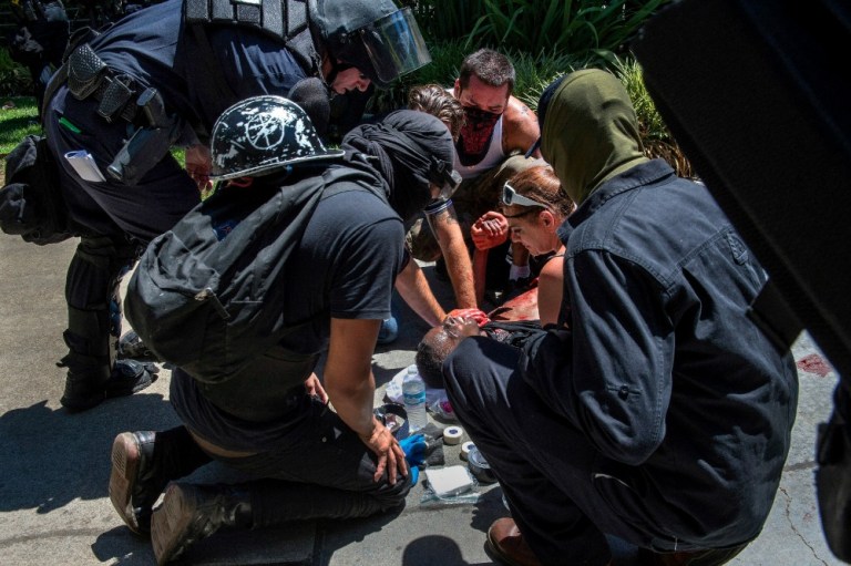The violence took place when a planned protest by the Traditional Worker Party, a group identified as a neo-Nazi organization by local media, met with counter-protestors. (AP Photo)